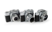 AGFA: Three&nbsp;c. 1960 chrome-body cameras - one Flexilette with unusual TLR&nbsp;design [#AB 6144] with Color Apotar 45mm f2.8 lens, one Ambiflex II SLR [#AR 2065] with Color-Solinar&nbsp;50mm f2.8 lens, and one Colorflex&nbsp;SLR [#JG 3040] with Color-Apotar 50mm f2.8 le