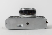 OLYMPUS: 1985 Olympus Trip 35 compact camera [#5453231], in chrome, with D. Zuiko 40mm f2.8 lens. On receipt of this camera, Michael's Camera Video & Digital were informed by the manufacturer that this example was the final Trip 35 ever to be produced, wi - 5