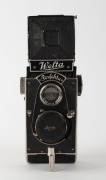 WELTA: Perfekta&nbsp;TLR camera featuring unusual folding body, c. 1934, with Trioplan 75mm f3.5 lens [#744548] and Compur-Rapid shutter, together with lens cap. - 2