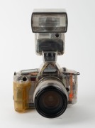 CANON: Transparent-body Canon EOS 650, c. 1987, with EF Zoom 35-105mm f3.5-4.5 lens, 420EZ battery-operated flash unit [#F055E], and rubber eyepiece attachment. Intended as a sales aid to illustrate the advantages of the EOS 650 to potential buyers. - 2