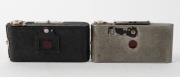 HOUGHTON: Two c. 1935 subminiature folding cameras - one Ensign Midget Silver Jubilee S55 with Ensar f6.3 Anastigmat lens, finished in silver enamel to commemorate the Silver Jubilee of King George V, together with one black-body Midget Model 22 with meni - 3