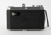 KODAK: German-made Suprema horizontal-folding camera [#210 966 K], c. 1939, with Xenar 80mm f3.5 lens [#1226757] and Compur-Rapid shutter. One of only approximately 1800 to be produced. - 3