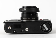 MINOLTA: Black-body Minolta CLE rangefinder camera [#1026865], c. 1981, with M-Rokkor 40mm f2 lens [#2113964], together with front lens cap, Minolta rubber lens hood, and Minolta Auto CLE flash unit in leatherette case. Produced in partnership with Leica. - 5