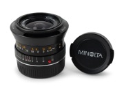 MINOLTA: Black M-Rokkor&nbsp;28mm f2.8 lens [#1008837] with Leica M bayonet mount, c. 1981, together with&nbsp;black metal lens hood, and front and rear lens caps.
