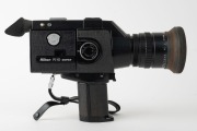 NIPPON KOGAKU: Circa 1973 Nikon R10 Super 8mm movie camera [#792850] with Cine-Nikkor Zoom&middot;C Macro 7-70mm f1.4 lens, UV lens filter, rubber lens hood, rubber eyepiece, and wrist strap. - 2