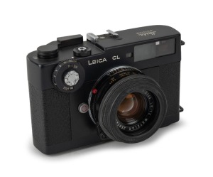 LEITZ: Leica CL rangefinder camera [#1311705], c. 1973, with Summicron-C 40mm f2 lens [#2591496] and rubber lens hood.