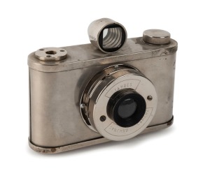 TAHBES: Synchro medium-format camera, c. 1948, with polished metal body, meniscus lens, and unusual Albada finder.