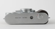 MINOLTA: Minolta Prod-20's retro-design 35mm compact camera [#33865], c. 1990, with Minolta 35mm f4.5 lens and metal lens cap. Maker's box with suede pouch, wrist strap, and printed matter also present. - 4