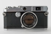 CANON: L1 rangefinder camera [#551112] in chrome, c. 1956, with Canon 50mm f1.8 lens [#218368]. One of only approximately 8000 units to be produced. - 2