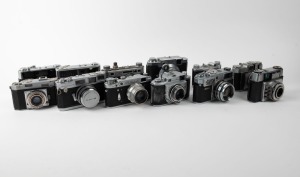 VARIOUS MANUFACTURERS: Twelve black-and-chrome rangefinder and viewfinder cameras - one Agfa Karat 12 2.8, one Ehira Camera 1941-type Weha Chrome Six III, one Eho-Altissa Altix IV, one FED type D FED 2, one Hanimex Electra II, one Minolta A, one Minolta Hi-matic, one Okaya Optic Lord SE with lens cap, one Olympus 35 S Electro-Set, one Royer Savoy IIc, one Taiyodo Koki Beauty LM, and one USA Camera Corporation Perfex Fifty-Five. (12 cameras)