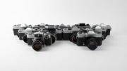 VARIOUS MANUFACTURERS: Eleven black-and-chrome SLR cameras - one&nbsp;Foto-Quelle&nbsp;Revueflex SL 301, one Ihagee Exakta RTL 1000, one Kamera Werkst&auml;tten&nbsp;Praktica VLC2, one Mamiya/Sekor 500 DTL, one Minolta SR-1 with front lens cap, one Minolta SRT-101 with front - 2