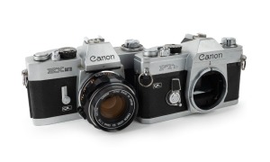 CANON: Two chrome SLR cameras - one c. 1971 Canon FTb QL body [#513773], and one c. 1972 Canon EX Auto [268469] with EX 50mm f1.8 lens [#365762]. (2 cameras)