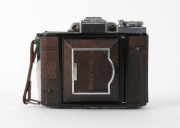ZEISS IKON: Rare brown-leather Super Ikonta&nbsp;A 531 vertical-folding rangefinder&nbsp;camera [#C12457], c. 1954, with Tessar&nbsp;75mm f3.5 lens [#995502] and&nbsp;Synchro-Compur&nbsp;shutter. - 2