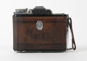 ZEISS IKON: Rare brown-leather Super Ikonta&nbsp;A 531 vertical-folding rangefinder&nbsp;camera [#C12457], c. 1954, with Tessar&nbsp;75mm f3.5 lens [#995502] and&nbsp;Synchro-Compur&nbsp;shutter. - 3