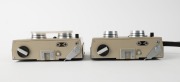 MEOPTA: Two Stereo 35 viewfinder cameras [#2-4547 & #2-5125] with twin Mirar 25mm f3.5 lenses, c. 1971, one in green with double lens cap, and one in black with wrist strap. (2 cameras) - 4