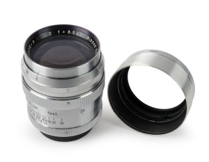 NIPPON KOGAKU: Chrome type 3 Nikkor-P·C 85mm f2 lens [#398590], c. 1958, with Leica-type screw mount, metal lens hood, and rear lens cap.