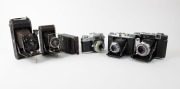 ZEISS IKON: An accumulation of six cameras - one c. 1927 Maximar 207/3 [#O88717], one c. 1929 Cocarette&nbsp;519/6 [#N98601], one c. 1930s Cocarette, one c. 1937 Super Ikonta B 532/16 [#X23852], one c. 1951 Ikonta M 524/16 [#U78537], and one c. 1959&nbsp;Contaflex 