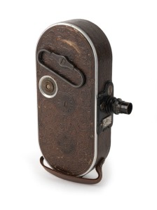 BELL & HOWELL: Filmo 75 16mm film camera [#48549], c. 1928, with beautifully ornate patterned brown leather covering.