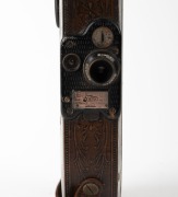 BELL & HOWELL: Filmo 75 16mm film camera [#48549], c. 1928, with beautifully ornate patterned brown leather covering. - 2