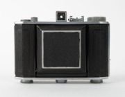 OLYMPUS: Chrome Six II vertical-folding camera [#34865], c. 1948, with Zuiko Coated 75mm f2.8 lens [#59760] and Copal lens. Presented with leather case in maker's wooden box that features etched text&nbsp;on lid. - 2