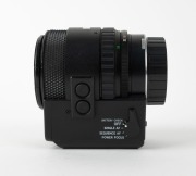 OLYMPUS: Black OM-System Zuiko Auto-Zoom 35-70mm f4 lens [#105032], c. 1982, with front and rear caps. - 2