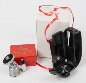 LEITZ: Two accessories in maker's boxes - one c. 1938 early-model FOOMI tripod head, and one c. 1970 14181 handgrip suitable for Leicaflex SL Mot. (2 items)