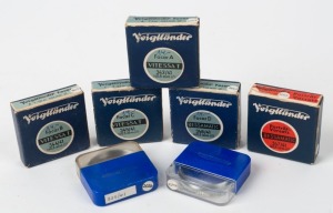 VOIGTLÄNDER: Seven 40.5mm lens filters in plastic maker's cases, five also with maker's boxes - two 343/41 Focar A filters, one 344/41 Focar B, one 345/41 Focar C, one 347/41 Bessamatic Portrait Lens, one 348/41 Bessamatic Focar B, and one 325/41 SF. (7 items)