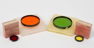 LEITZ: Four lens filters - one FIRHE Gelbfilter 1 in maker's box and one FCZOO Rotfilter Hell also in maker's box, together with two c. 1964 Serie VII lens filters in plastic cases - one in green with GGr designation, and one in orange with Or designation