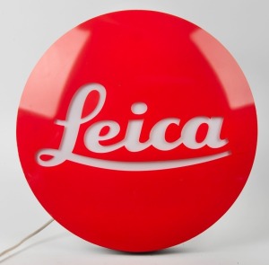 LEITZ: Leica 'Red Dot' point-of-sale wall lamp with on/off switch, power cable, and bracket holes on rear, in non-functional condition.