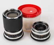 CARL ZEISS: Two c. 1970s lenses in black and chrome with M42 mounts - one Skoparex&nbsp;35mm f3.4 [#7023312] in plastic display dome, and one Super-Dynarex 135mm f4 [#7192387]. (2 lenses)