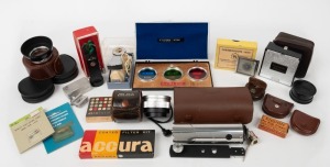 VARIOUS MANUFACTURERS: An accumulation of twenty-one photography accessories, most in maker's boxes or leather pouches, including flash units, several lens filters, and items labeled 'WEP Auto Kinotelex', 'Thermoscope 1080', 'Ensign Pen Print Trimmer', and 'Hakosyn', among many others. (21 items)