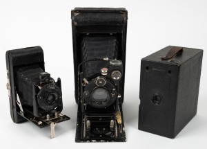 HOUGHTON: Three c. 1930s cameras - one Ensign Carbine vertical-folding camera with Xpres 6" f4.9 lens and shutter release cable, one No. 4 Watch Pocket Carbine vertical-folding camera with Aldis Uno Anastigmat 4.75" f7.7 lens, and one Ensign Junior Model B box camera. (3 cameras)