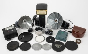VARIOUS MANUFACTURERS: An accumulation of eighteen photography accessories, comprising six Petri products, six Hanimex products, three Angénieux products, and three Diax products; included are flash units, lens caps, lens filters, etc. (18 items)