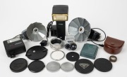 VARIOUS MANUFACTURERS: An accumulation of eighteen photography accessories, comprising six Petri products, six Hanimex&nbsp;products, three Ang&eacute;nieux&nbsp;products, and three Diax&nbsp;products;&nbsp;included are flash units, lens caps, lens filters, etc. (18 items)