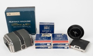 BRONICA: An accumulation of nine camera accessories, six of them in maker's boxes - one S2A film back magazine, two different GS-1 Diopters G for prism finder, three different GS-1 Diopters G for waist-level finder, one waist-level finder, and two lens caps. (9 items)