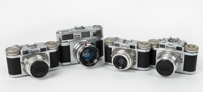 BRAUN: Four black and chrome c. 1950s 35mm cameras - one Paxette Super III, one Super Paxette with front lens cap, one Paxette, and one Paxette with front lens cap. (4 cameras)