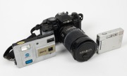 MINOLTA: Three cameras - one 1983 Minolta Disc-5, one 1985&nbsp;Minolta Maxxum 9000 AF with 28-135mm f4-4.5 lens, neck strap, and lens cap, and&nbsp;one&nbsp;2003 DiMage Xt.&nbsp;(3 cameras)