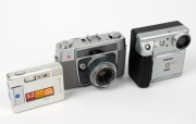 KONICA: Three cameras -&nbsp;one c. 1961 Konica L, one c. 1997 Konica Q Mini, and one Konica Minolta DiMage Xg.&nbsp;(3 cameras)