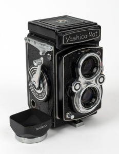 YASHICA: Circa 1957 Yashica-Mat TLR camera, with Lumaxar 80mm f3.5 lens and Yashica black metal lens hood.