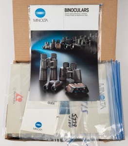 MINOLTA: One A4 archive box containing sixty Minolta product brochures and sales guides, each sealed in a plastic sleeve. (60 items)