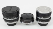 OLYMPUS: Three lenses in black and chrome with bayonet mounts for Olympus Ace series&nbsp;rangefinder cameras - one E. Zuiko-T 80mm f4 [#101130] with front and rear caps, one E. Zuiko-T 80mm f5.6 [#304017] with front and rear caps, and one E. Zuiko-W 35mm f2.8