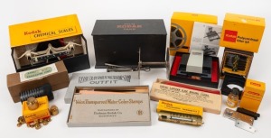 KODAK: Ten early photography accessories in maker's boxes - one Presstape Universal Splicer, one Kodascope Film Splicing Outfit, one Photographic Thermometer, one Polycontrast Filter Kit, one set of chemical scales, one 5-Inch Projection Lens, one set of 