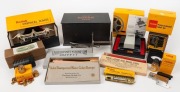 KODAK: Ten early photography accessories in maker's boxes - one Presstape Universal Splicer, one Kodascope Film Splicing Outfit,&nbsp;one Photographic Thermometer, one Polycontrast Filter Kit, one set of chemical scales, one 5-Inch Projection Lens, one set of 