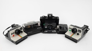 POLAROID: Four instant film cameras - one transparent Polaroid Spectra, one 1000 OneStep Polaroid Land Camera with wrist strap, one 1000 Polaroid Land Camera, and one Polaroid EE 100 Special. (4 cameras)