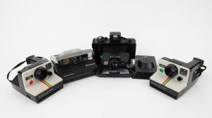 POLAROID: Four instant film cameras - one transparent Polaroid Spectra, one 1000 OneStep Polaroid Land Camera with wrist strap, one 1000 Polaroid Land Camera, and one Polaroid EE 100 Special. (4 cameras)