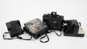 POLAROID: Four instant film cameras - one transparent Polaroid Spectra, one 1000 OneStep Polaroid Land Camera with wrist strap, one 1000 Polaroid Land Camera, and one Polaroid EE 100 Special.&nbsp;(4 cameras) - 2