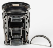 TAMRON: Half cutaway model Tamron SP 28-135mm f4-4.5 lens,&nbsp;presented by Tamron representatives during their viewing of the Michael's Camera Museum in June 1993.