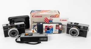 CANON: Four late 1970s/early 1980s compact cameras - one Canomatic M 70, one Canomatic M 70 in maker's leather case, one Canon 110ED with wrist strap, and one Snappy '84 Los Angeles Olympics edition with wrist strap and instruction sheet in maker's box. (