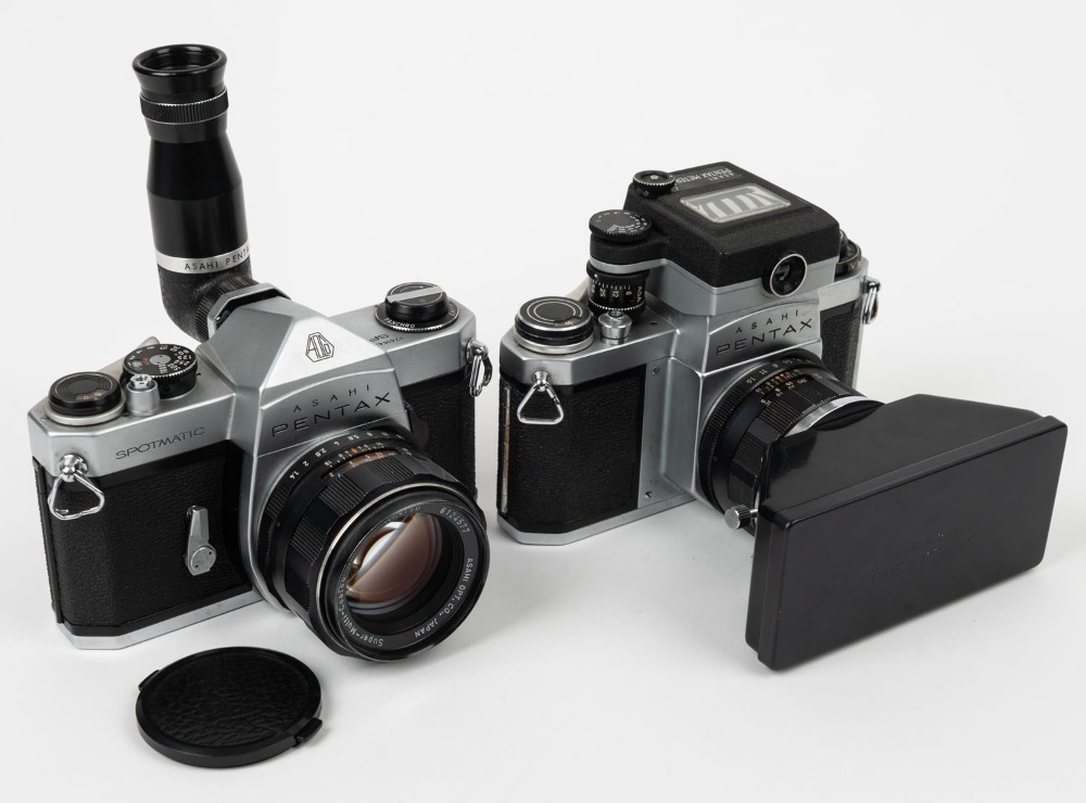 ASAHI KOGAKU: Two SLR cameras with several attachments - one 1962