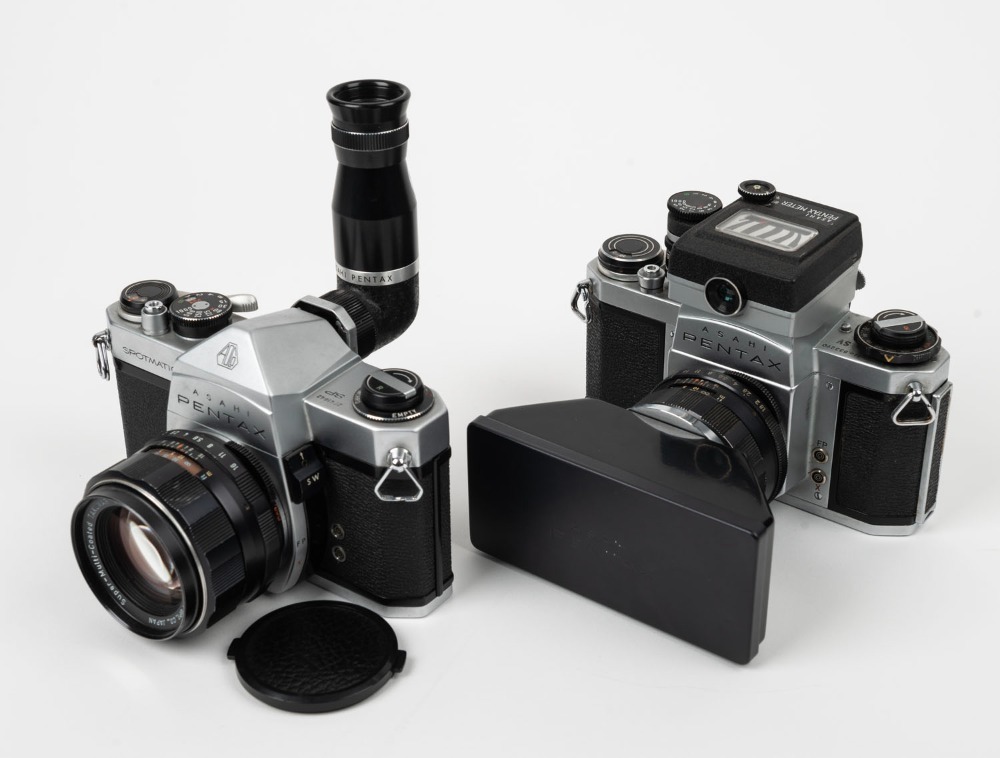 ASAHI KOGAKU: Two SLR cameras with several attachments - one 1962 Pentax SV  [#833290] with Super-